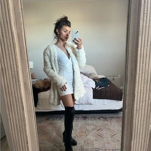 White Faux Fur Coat with Black Boots
